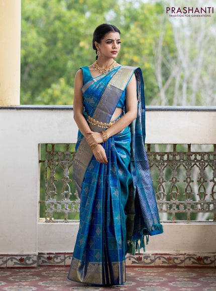 Pure kanchipuram silk saree dual shade of peacock blue with allover self emboss & zari weaves and zari woven border