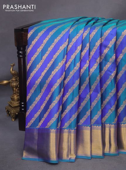 Pure kanchipuram silk saree blue and peacock blue with allover zari woven stripes pattern and zari woven border