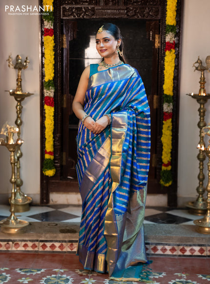 Pure kanchipuram silk saree blue and peacock blue with allover zari woven stripes pattern and zari woven border