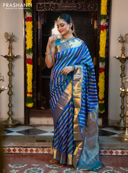 Pure kanchipuram silk saree blue and peacock blue with allover zari woven stripes pattern and zari woven border