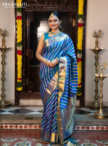 Pure kanchipuram silk saree blue and peacock blue with allover zari woven stripes pattern and zari woven border