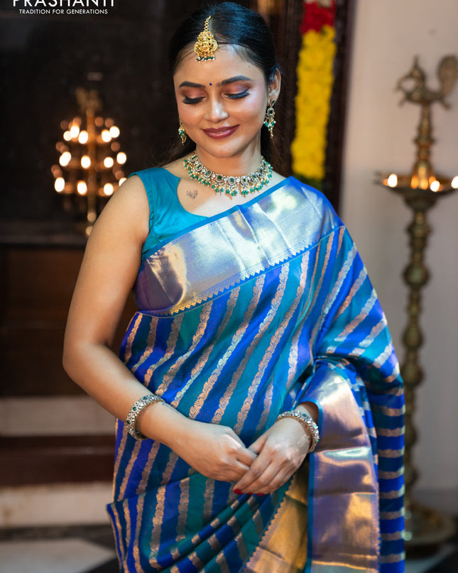 Pure kanchipuram silk saree blue and peacock blue with allover zari woven stripes pattern and zari woven border