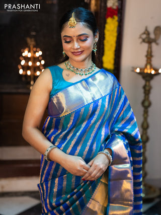Pure kanchipuram silk saree blue and peacock blue with allover zari woven stripes pattern and zari woven border