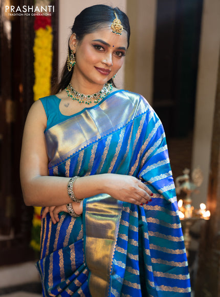 Pure kanchipuram silk saree blue and peacock blue with allover zari woven stripes pattern and zari woven border