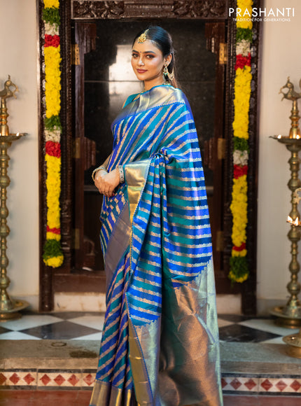 Pure kanchipuram silk saree blue and peacock blue with allover zari woven stripes pattern and zari woven border