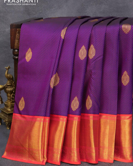 Pure kanjivaram silk saree dark blue and dual shade of pinkish orange with allover self emboss & zari buttas and rich zari woven border