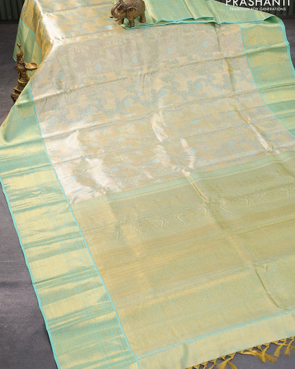 Pure kanjivaram tissue silk saree cream and teal blue with allover zari woven brocade weaves and zari woven border