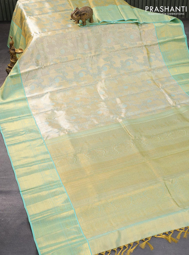 Pure kanjivaram tissue silk saree cream and teal blue with allover zari woven brocade weaves and zari woven border