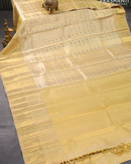 Pure kanjivaram tissue silk saree gold with allover zari woven brocade weaves and long zari woven border