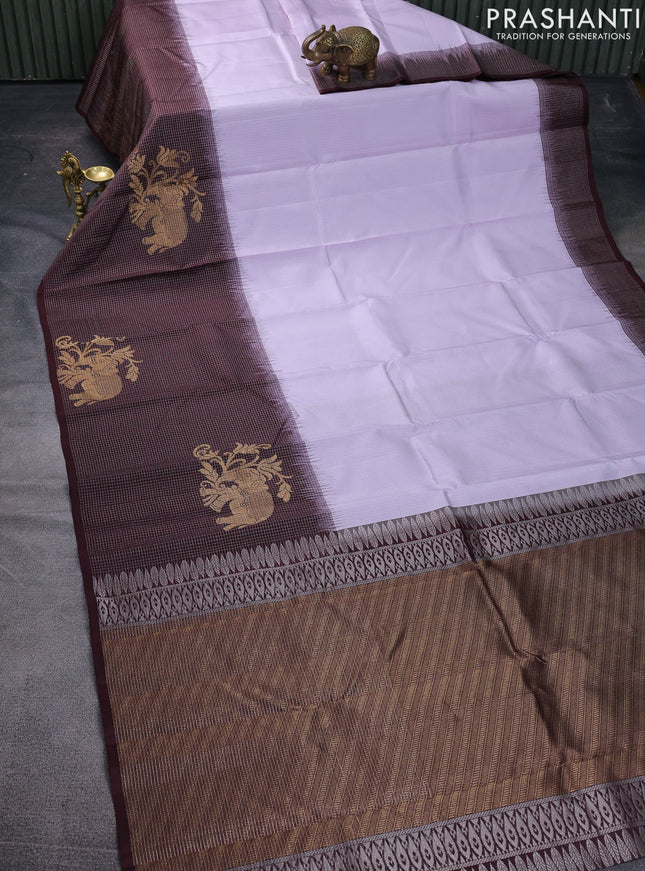 Pure soft silk saree pastel lavender and wine shade with allover zari weaves and long zari woven border