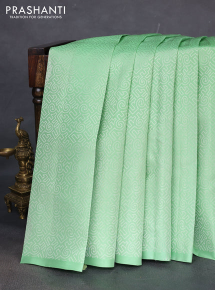 Pure soft silk saree pista green and dark magenta pink with allover self emboss in borderless style