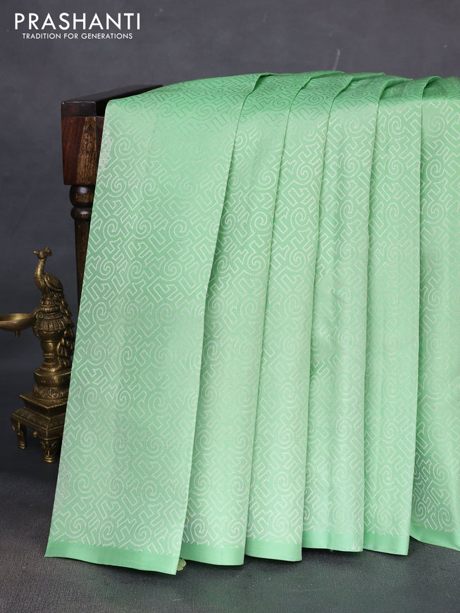 Pure soft silk saree pista green and dark magenta pink with allover self emboss in borderless style