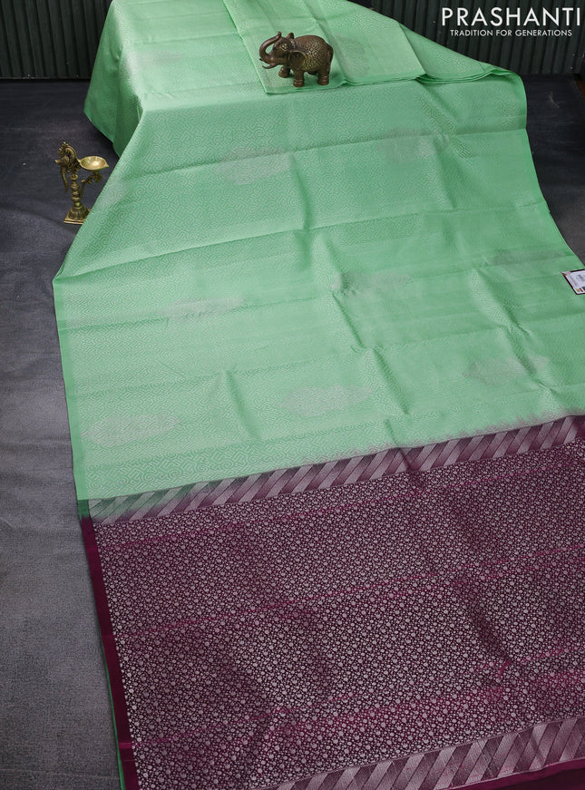 Pure soft silk saree pista green and dark magenta pink with allover self emboss in borderless style