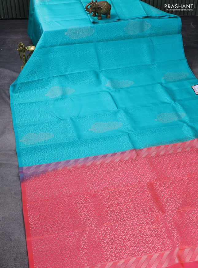 Pure soft silk saree teal blue and dual shade of pinkish orange with allover self emboss in borderless style
