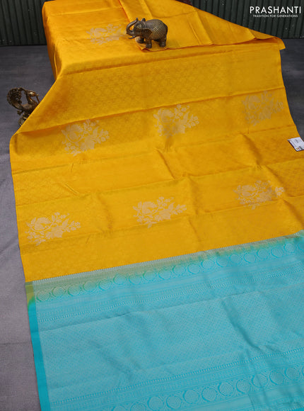 Pure soft silk saree mustard yellow and teal blue with allover self emboss in borderless style