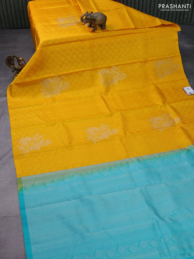 Pure soft silk saree mustard yellow and teal blue with allover self emboss in borderless style