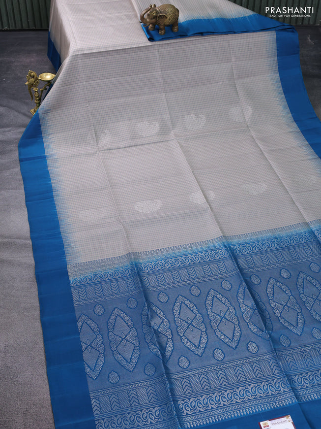 Pure soft silk saree grey shade and peacock blue with allover checked pattern & zari woven buttas and simple border