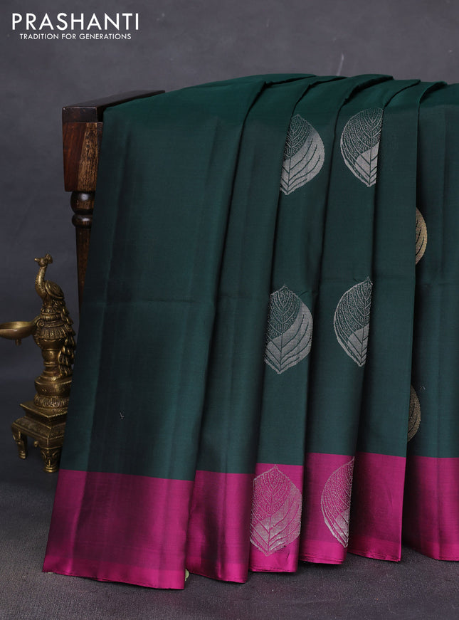 Pure soft silk saree bottle green and pink witn zari woven buttas and zari woven butta border