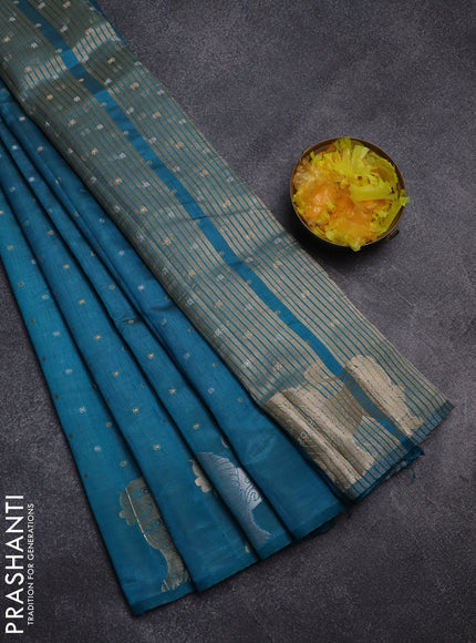 Semi raw silk saree teal blue with allover silver & gold zari woven buttas and zari woven lion butta border