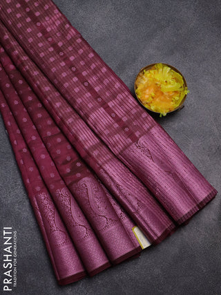Semi raw silk saree wine shade with allover pink zari woven buttas and paisley design pink zari woven border