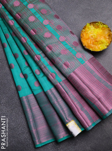 Semi raw silk saree teal green with allover pink zari woven buttas and pink zari woven border