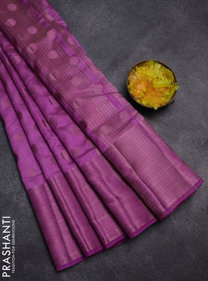 Semi raw silk saree lavender shade with allover pink zari woven buttas and pink zari woven border