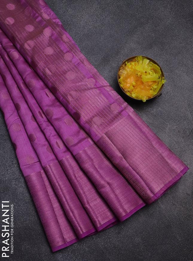 Semi raw silk saree lavender shade with allover pink zari woven buttas and pink zari woven border