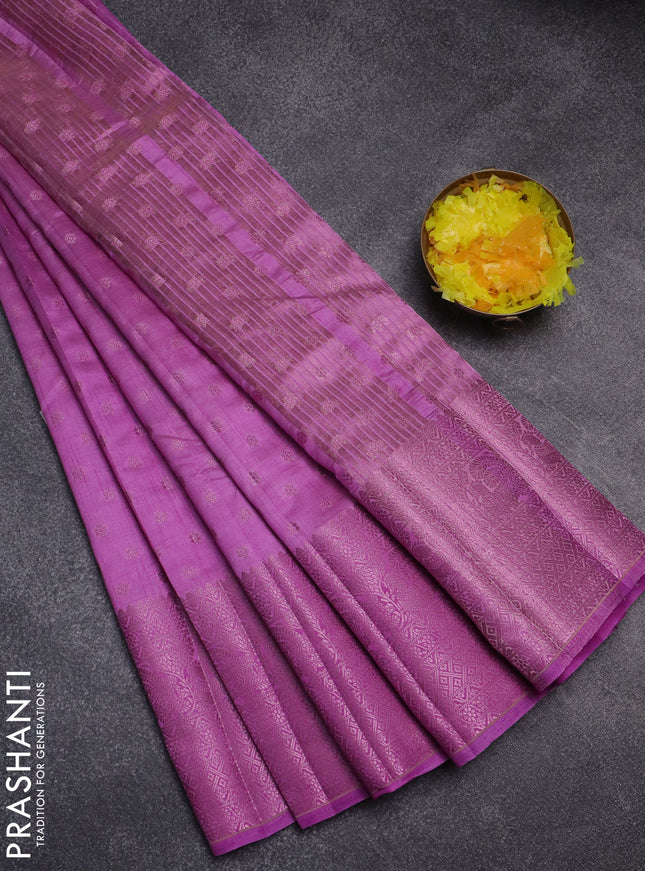Semi raw silk saree lavender shade with allover pink zari woven buttas and pink zari woven border