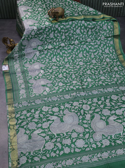 Printed silk saree green with allover kalamkari prints and zari woven border