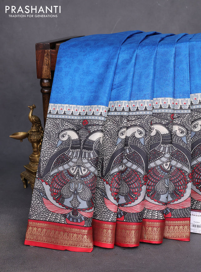 Printed silk saree blue and red with allover prints and long printed zari border