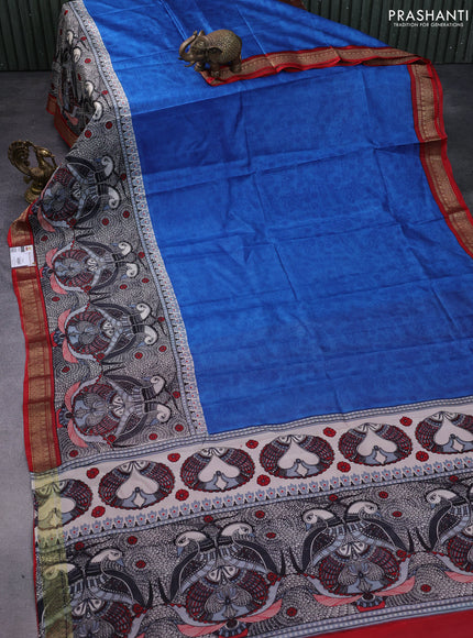 Printed silk saree blue and red with allover prints and long printed zari border