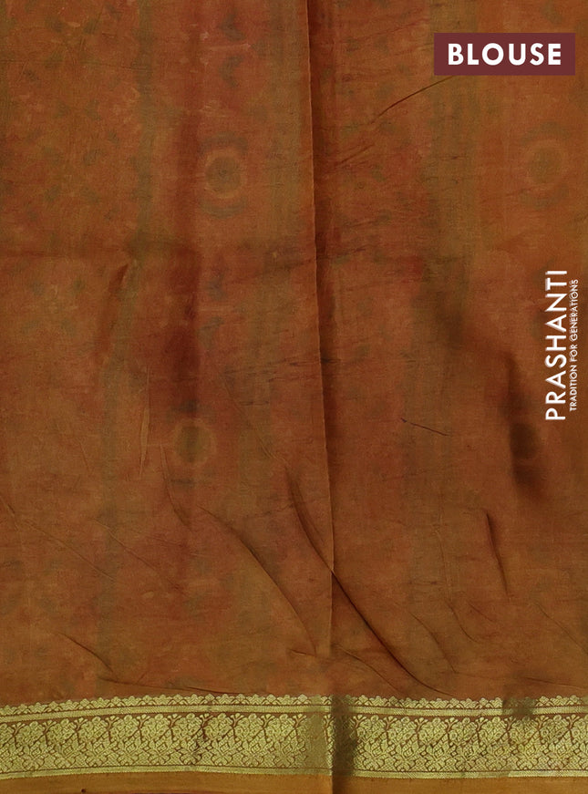 Printed silk saree red and dark mustard with allover ikat prints and zari woven border