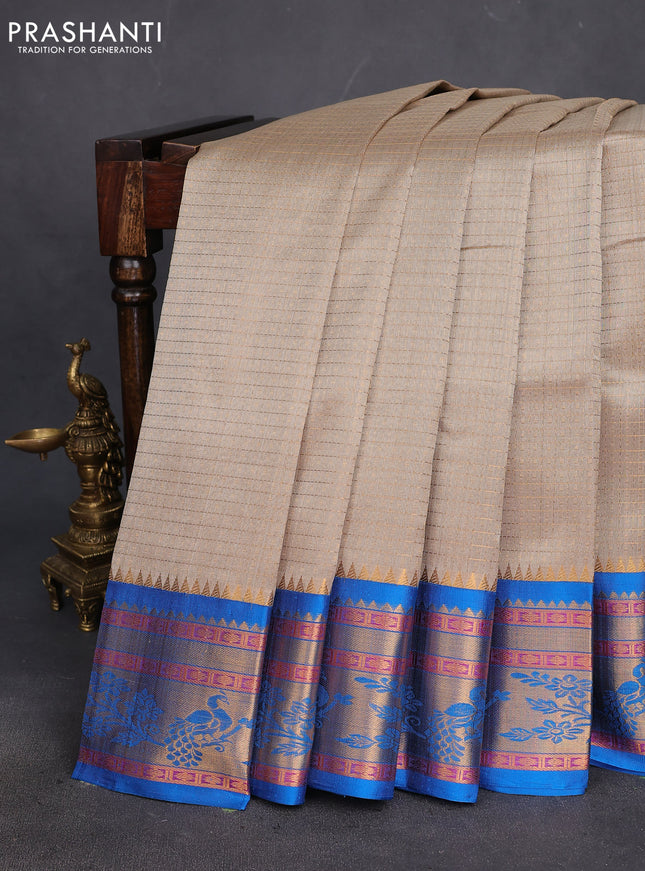 Kuppadam silk cotton saree beige and cs blue with allover lakshadeepam weaves and rich zari woven border