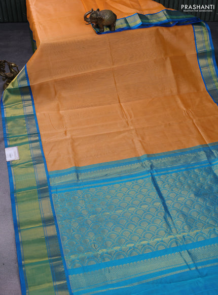 Kuppadam silk cotton saree pale orange and cs blue with plain body and rich zari woven border
