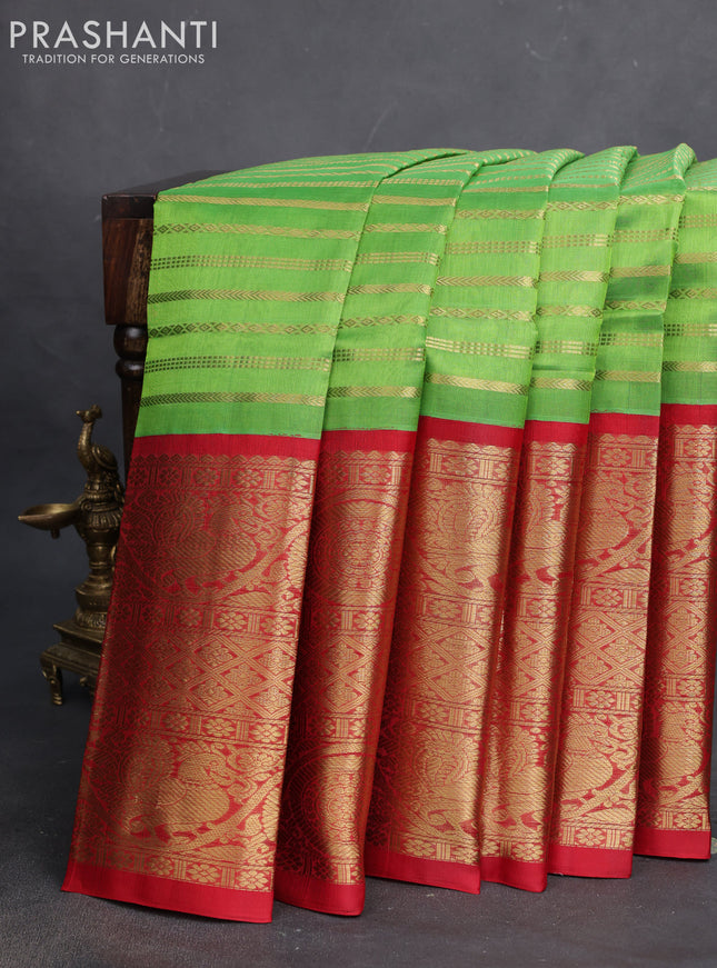 Kuppadam silk cotton saree parrot green and red with allover zari woven veldhari pattern and long zari woven border