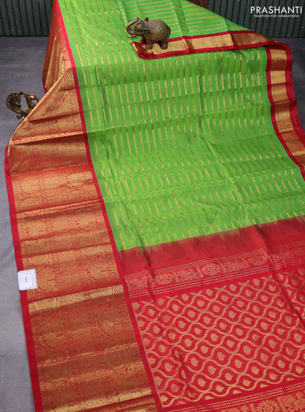 Kuppadam silk cotton saree parrot green and red with allover zari woven veldhari pattern and long zari woven border