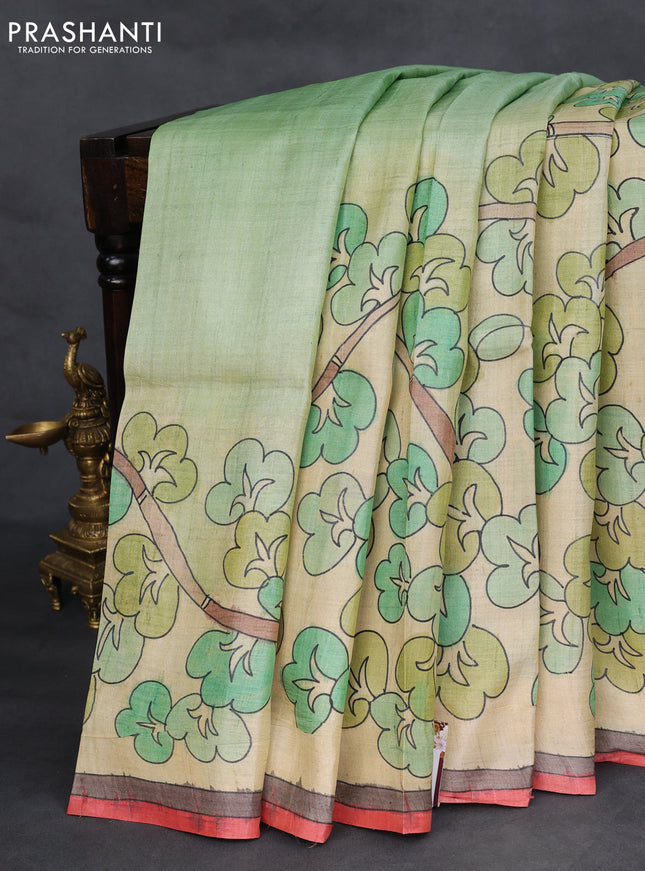 Pure tussar silk saree pastel green and cream with hand painted prints and simple border
