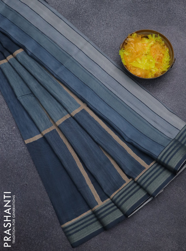 Semi tussar saree teal blue shade with allover prints and zari woven border