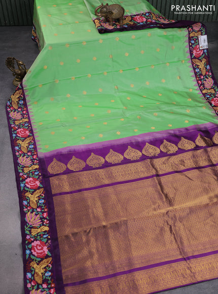 Pure gadwal silk saree light green and deep purple with zari woven buttas and temple design embroidery border