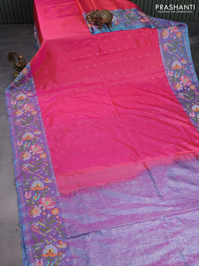 Pure soft silk saree dual shade of pinkish orange and blue shade with silver zari woven buttas and floral design embroidery border