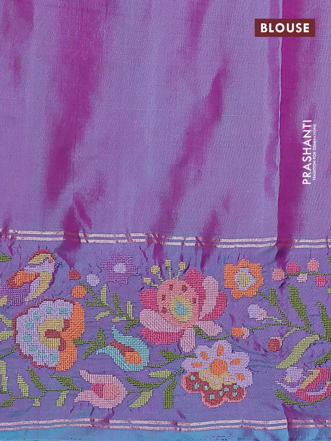 Pure soft silk saree dual shade of pinkish orange and blue shade with silver zari woven buttas and floral design embroidery border
