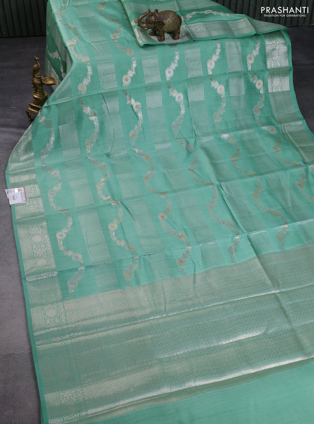 Chiniya silk saree teal green shade with allover zari weaves and zari woven border