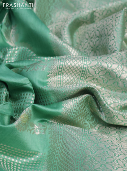 Chiniya silk saree teal green shade with allover zari weaves and zari woven border