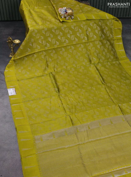 Chiniya silk saree lime yellow with allover silver zari weaves and temple design zari woven border