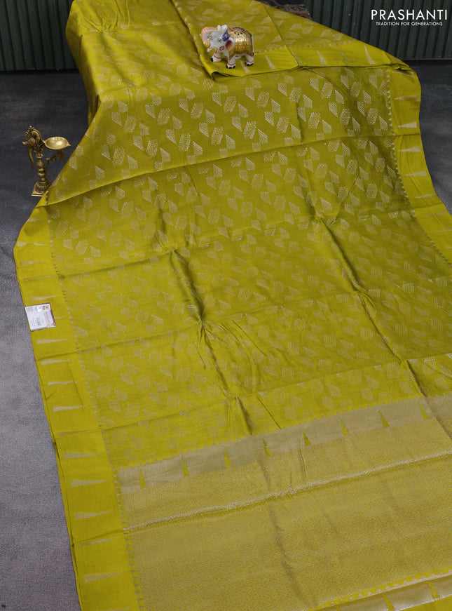 Chiniya silk saree lime yellow with allover silver zari weaves and temple design zari woven border