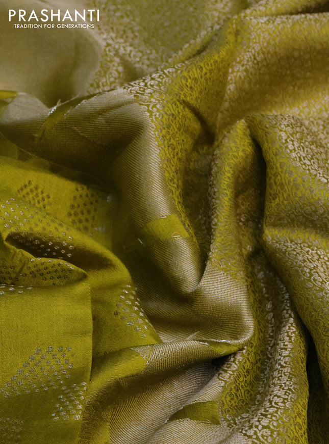 Chiniya silk saree lime yellow with allover silver zari weaves and temple design zari woven border