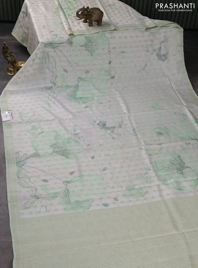 Chiniya silk saree off white and pastel green with allover silver zari buttas & digital prints and zari woven border