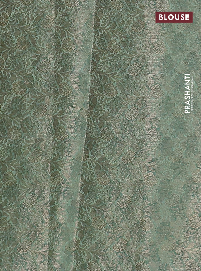 Chiniya silk saree rust shade and pastel green with zari woven buttas & digital prints and zari woven border