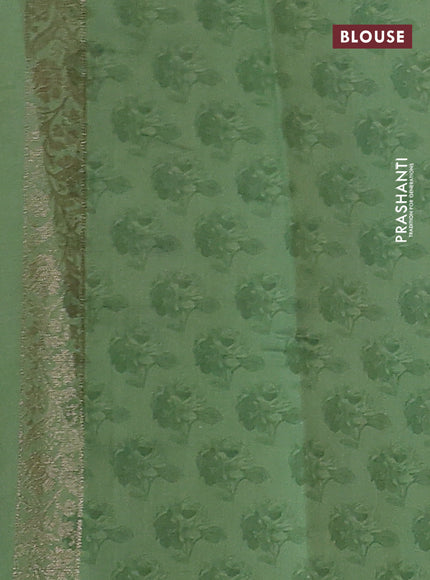 Chiniya silk saree rust shade and pastel green with zari woven buttas & digital prints and zari woven border