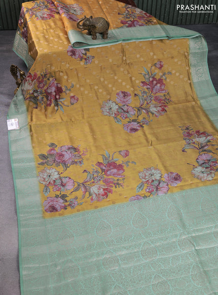 Chiniya silk saree dark mustard and pastel blue shade with allover woven buttas & floral digital prints and zari woven border